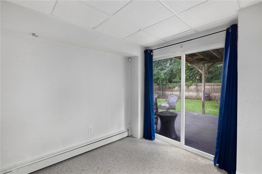 13 Lawrence Road North Providence, RI 02911 - Photo 23 of 31 The lower level offers a walk out to the second, trex deck and provides a spacious feeling to this room.