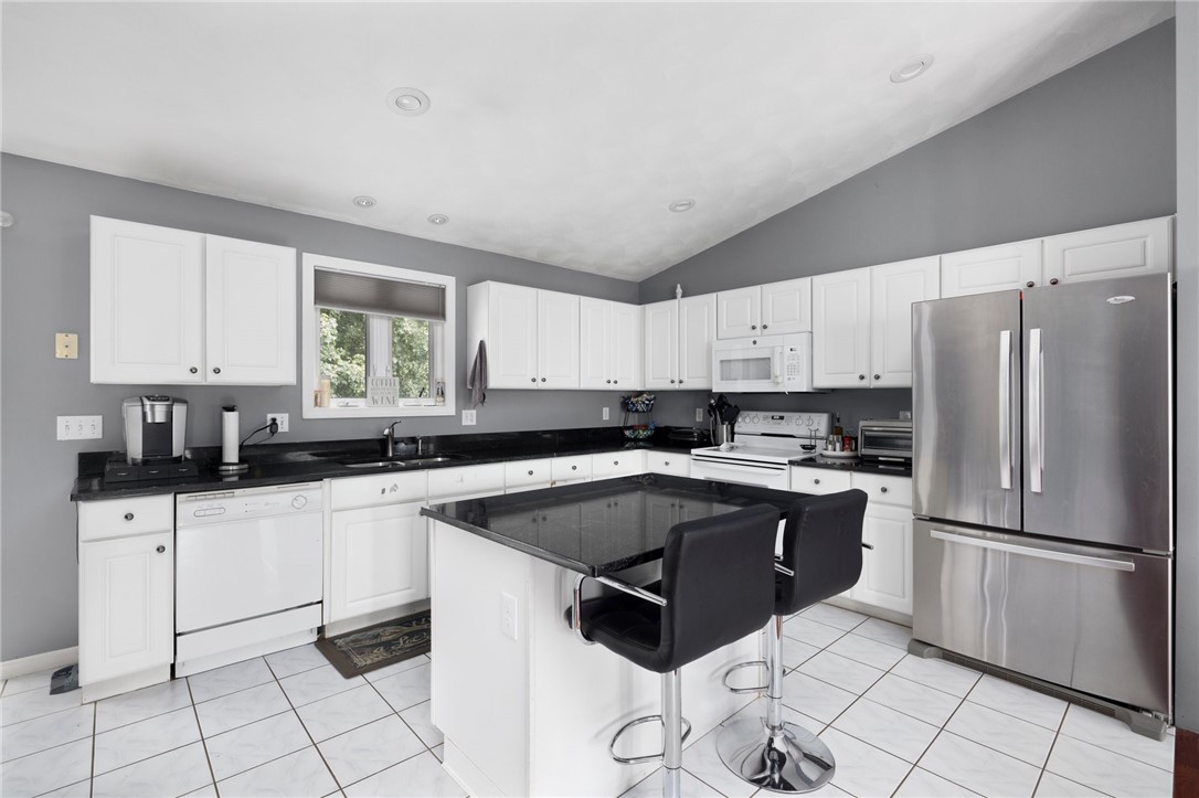13 Lawrence Road North Providence, RI 02911 - Photo 3 of 31 A modern, eat in kitchen offers ample storage.
