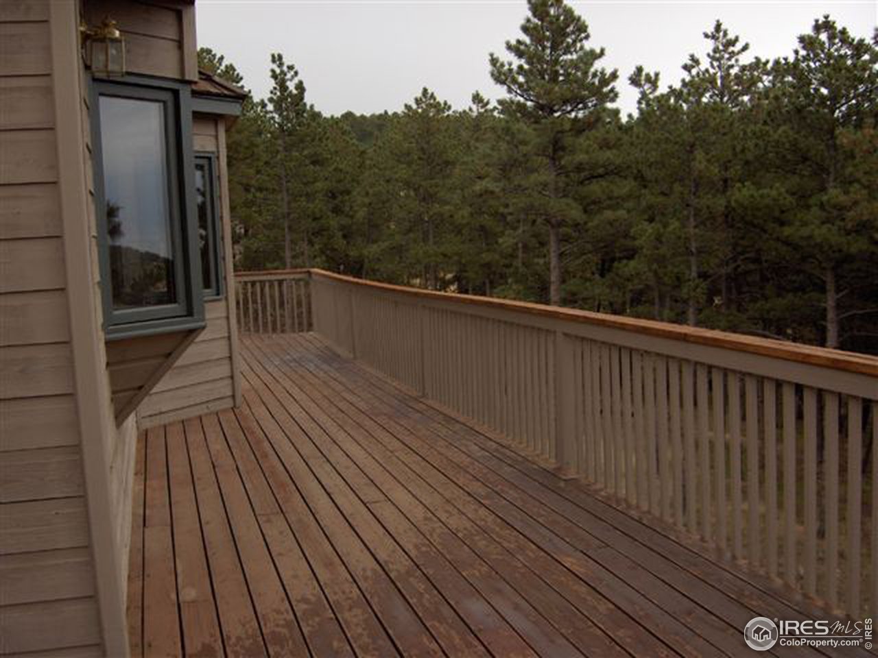 180 Peakview Road Boulder, CO 80302 - Photo 2 of 4 a view of balcony with wooden floor and fence