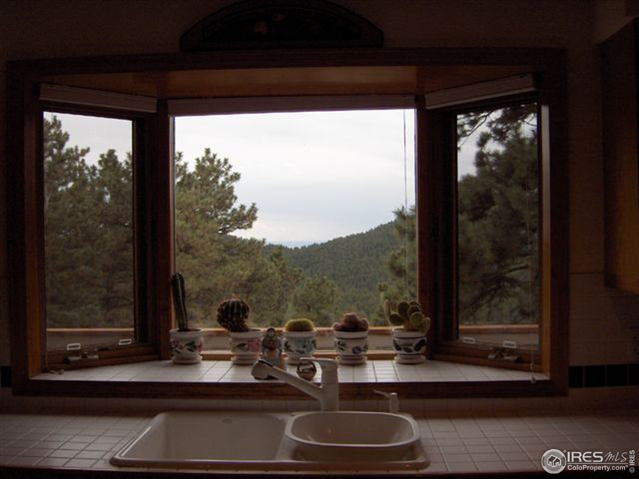180 Peakview Road Boulder, CO 80302 - Photo 3 of 4 a room with a large window and sitting area