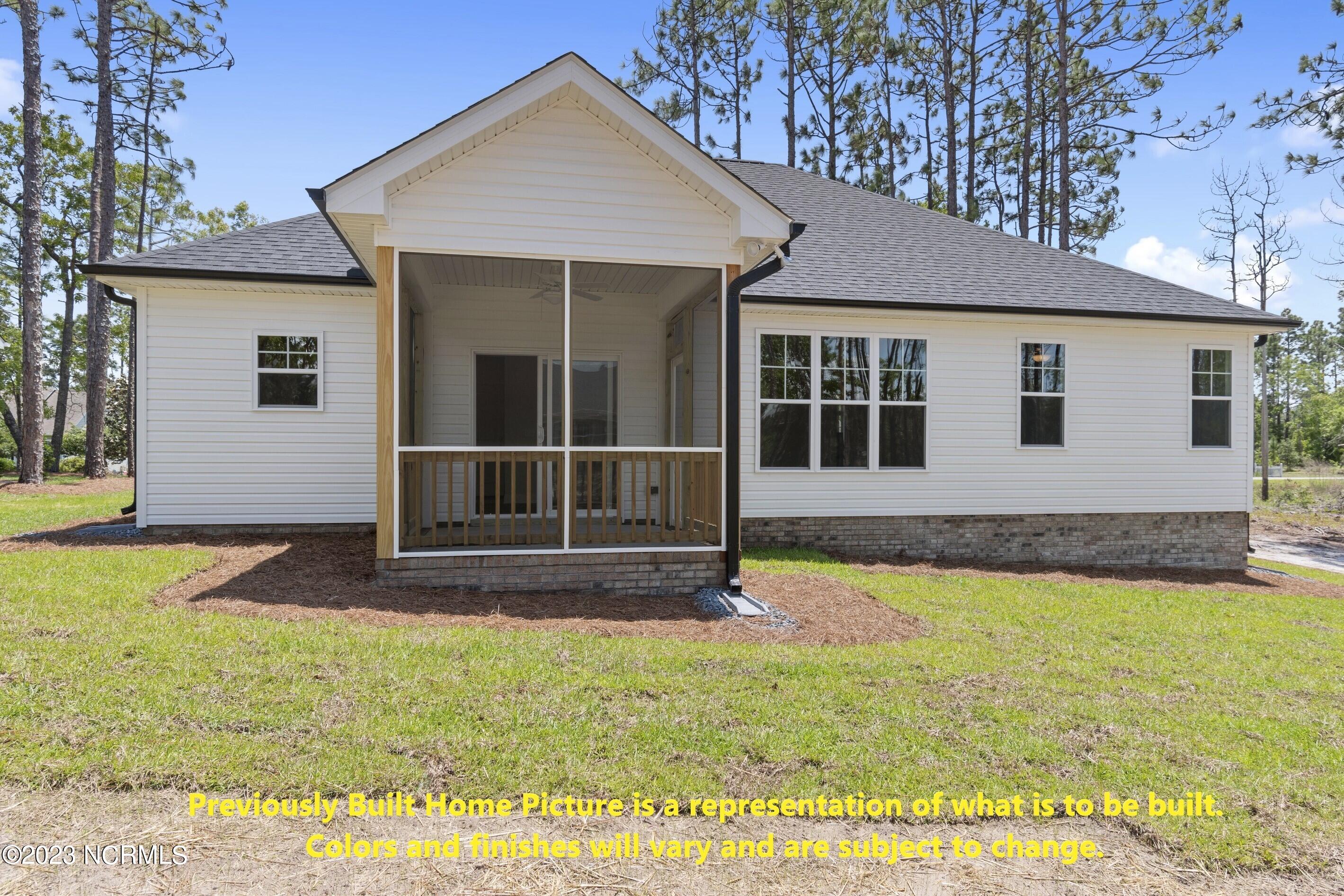1028 Longleaf Road Southport, NC 28461 - Photo 2 of 49 Previously Built Home Picture is a representation of what is to be built. Colors and finishes will vary and are subject to change.