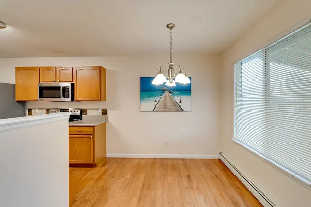 a view of a kitchen with a sink dishwasher and microwave