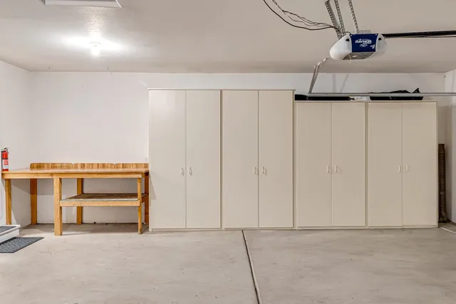 view of an empty room with cabinet and a window