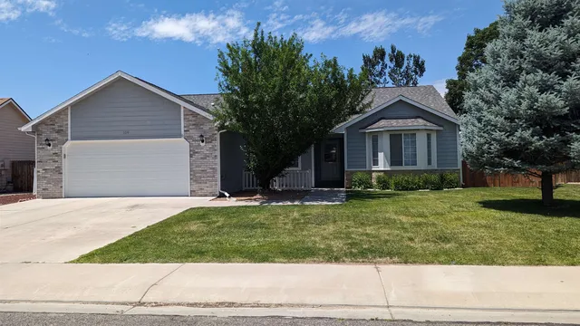 a view of a backyard with swimming pool