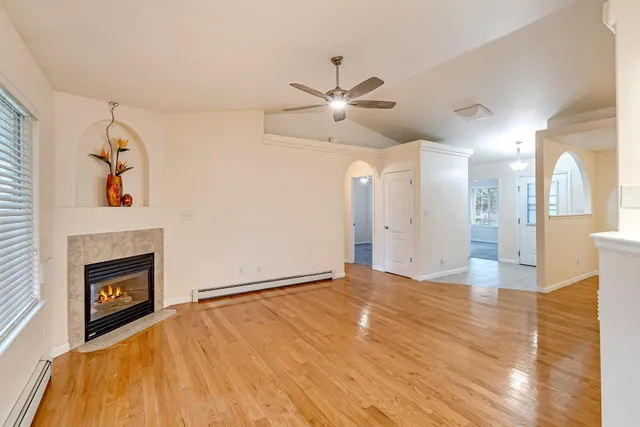 a view of empty room with a fireplace