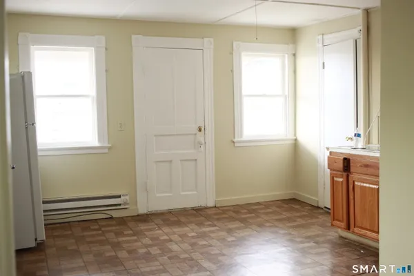 a view of an empty room with a window
