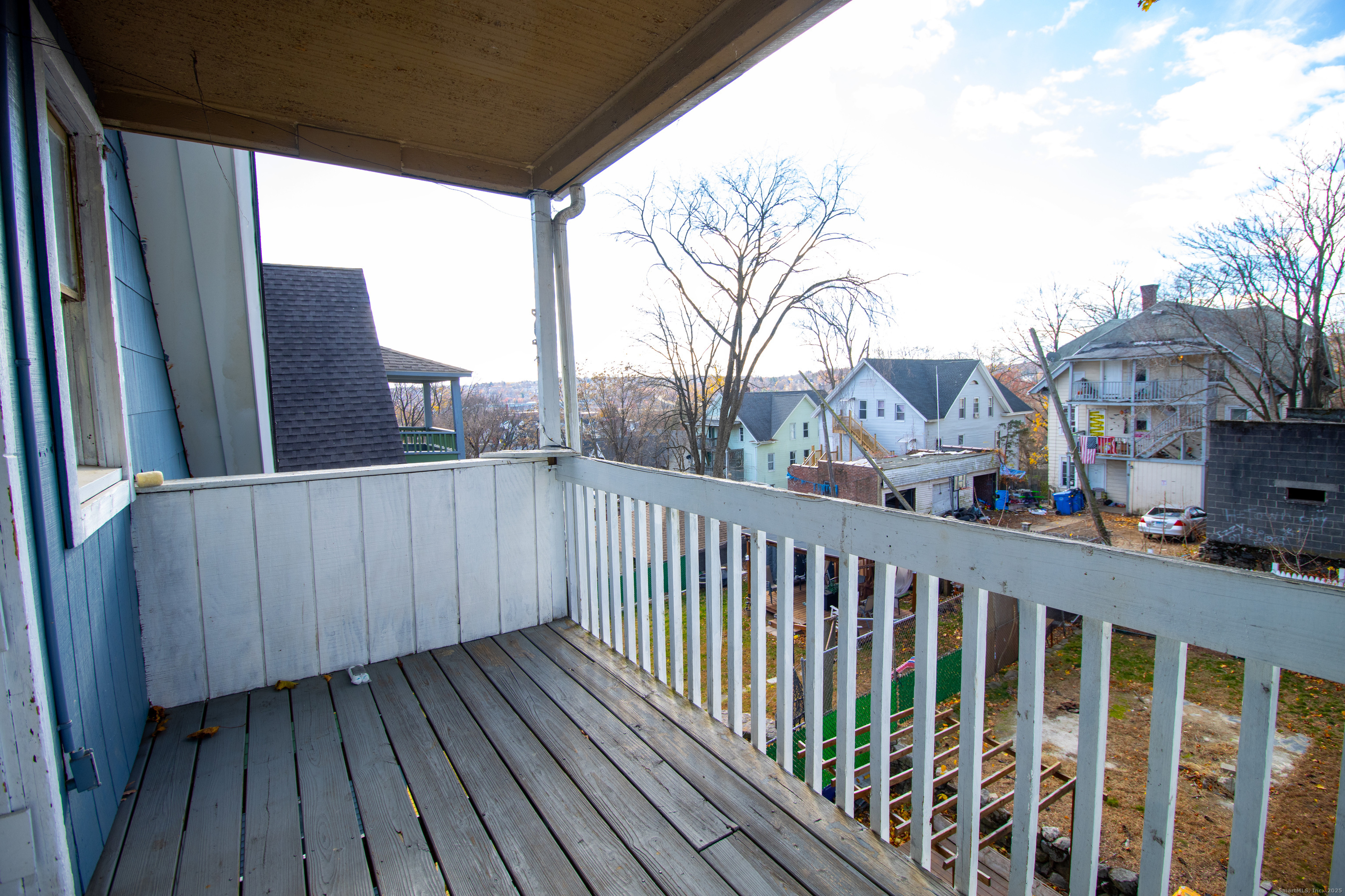 175 Chestnut Avenue Waterbury, CT 06710 - Photo 12 of 15 a view of balcony with wooden floor and fence