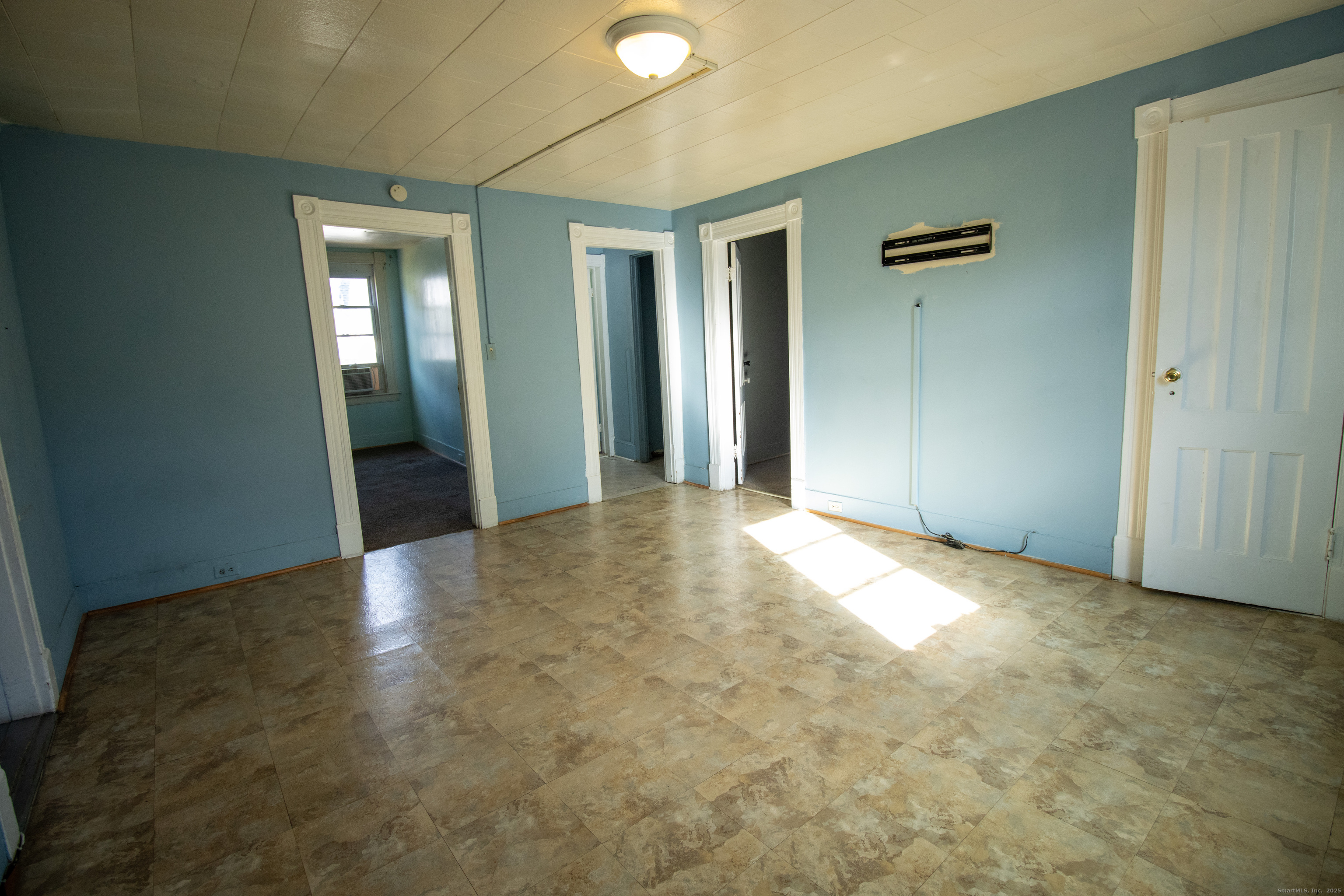 175 Chestnut Avenue Waterbury, CT 06710 - Photo 2 of 15 an empty room with closet and a bathroom