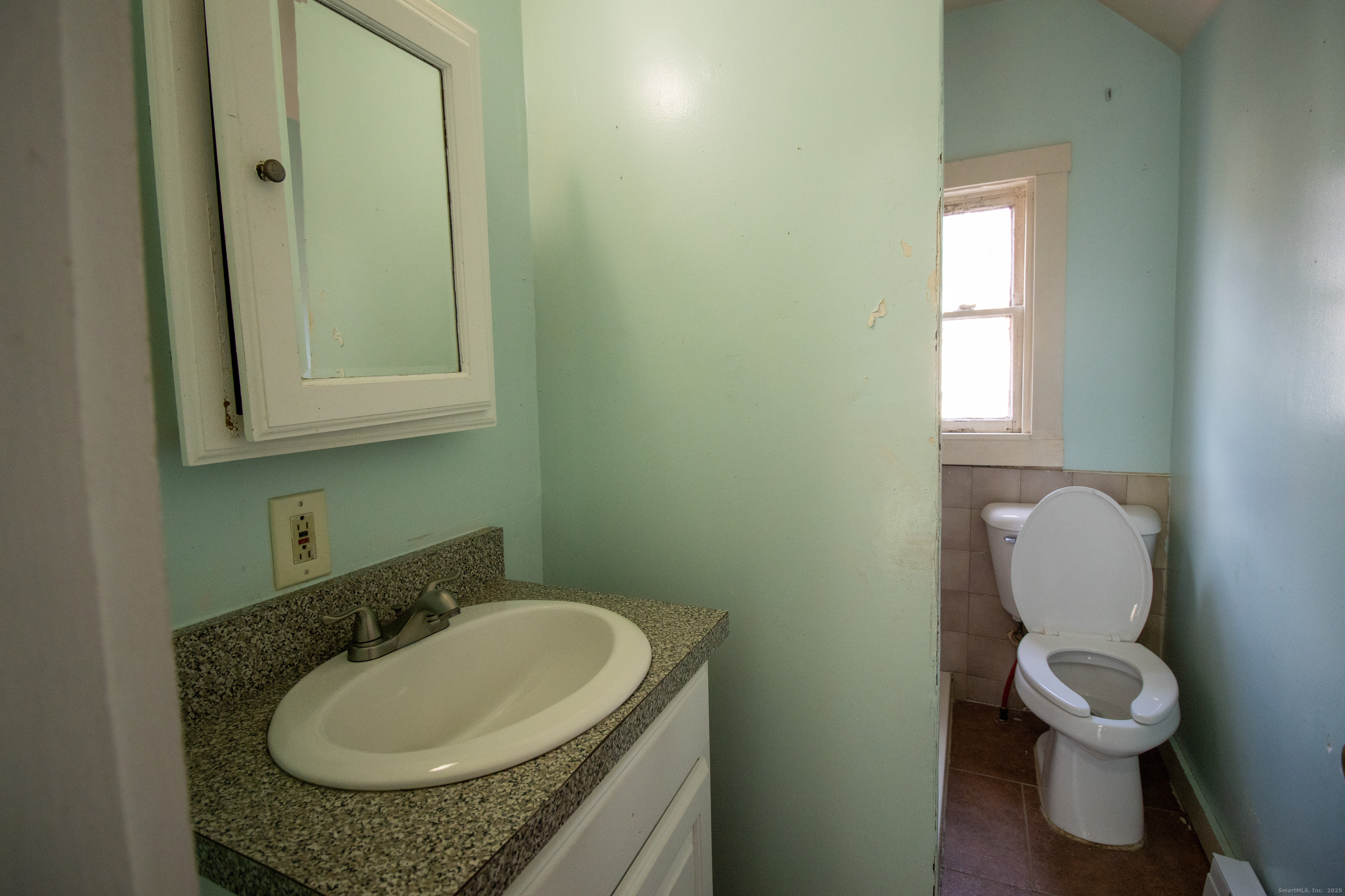 175 Chestnut Avenue Waterbury, CT 06710 - Photo 3 of 15 a bathroom with a sink and a toilet