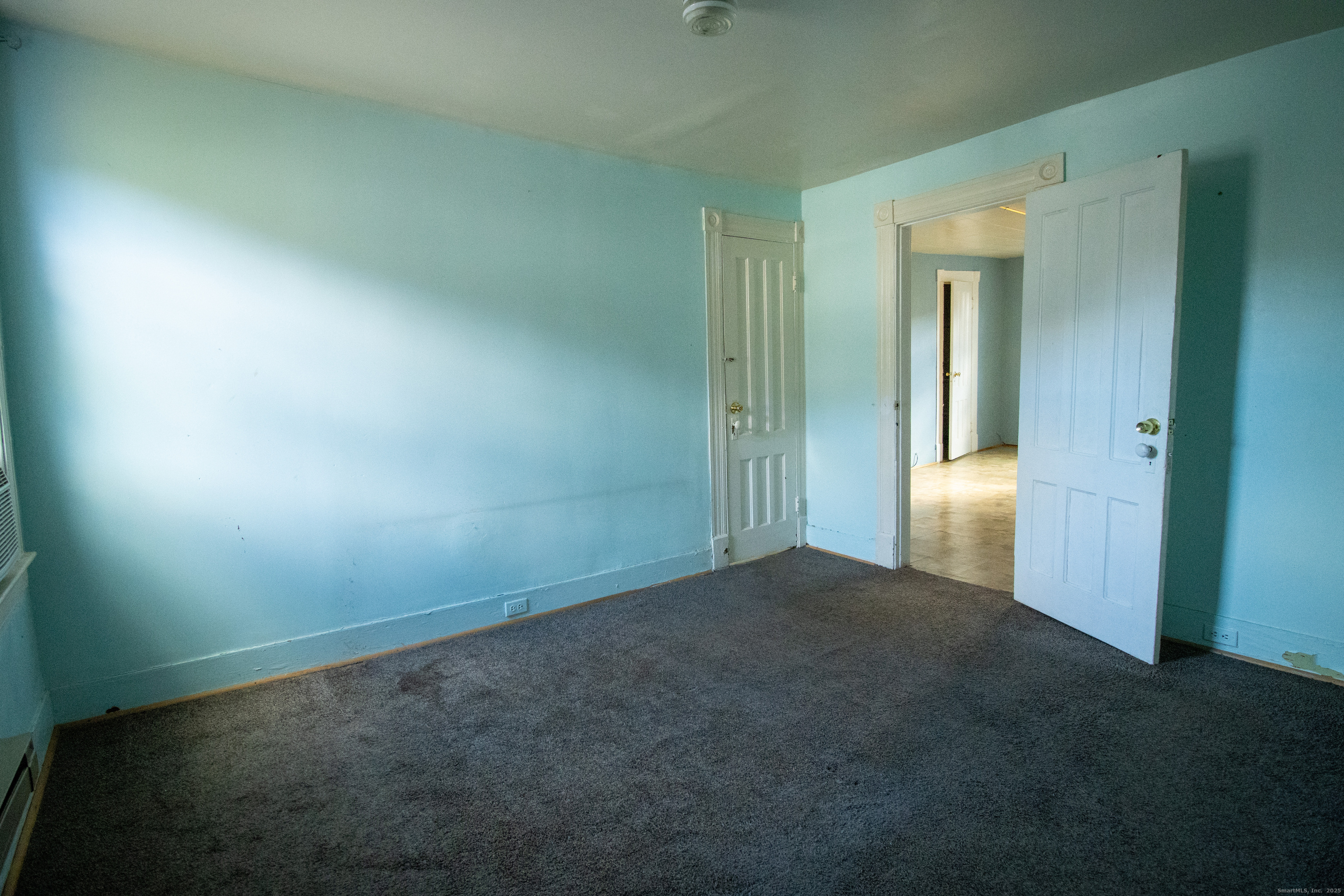 175 Chestnut Avenue Waterbury, CT 06710 - Photo 6 of 15 an empty room with windows