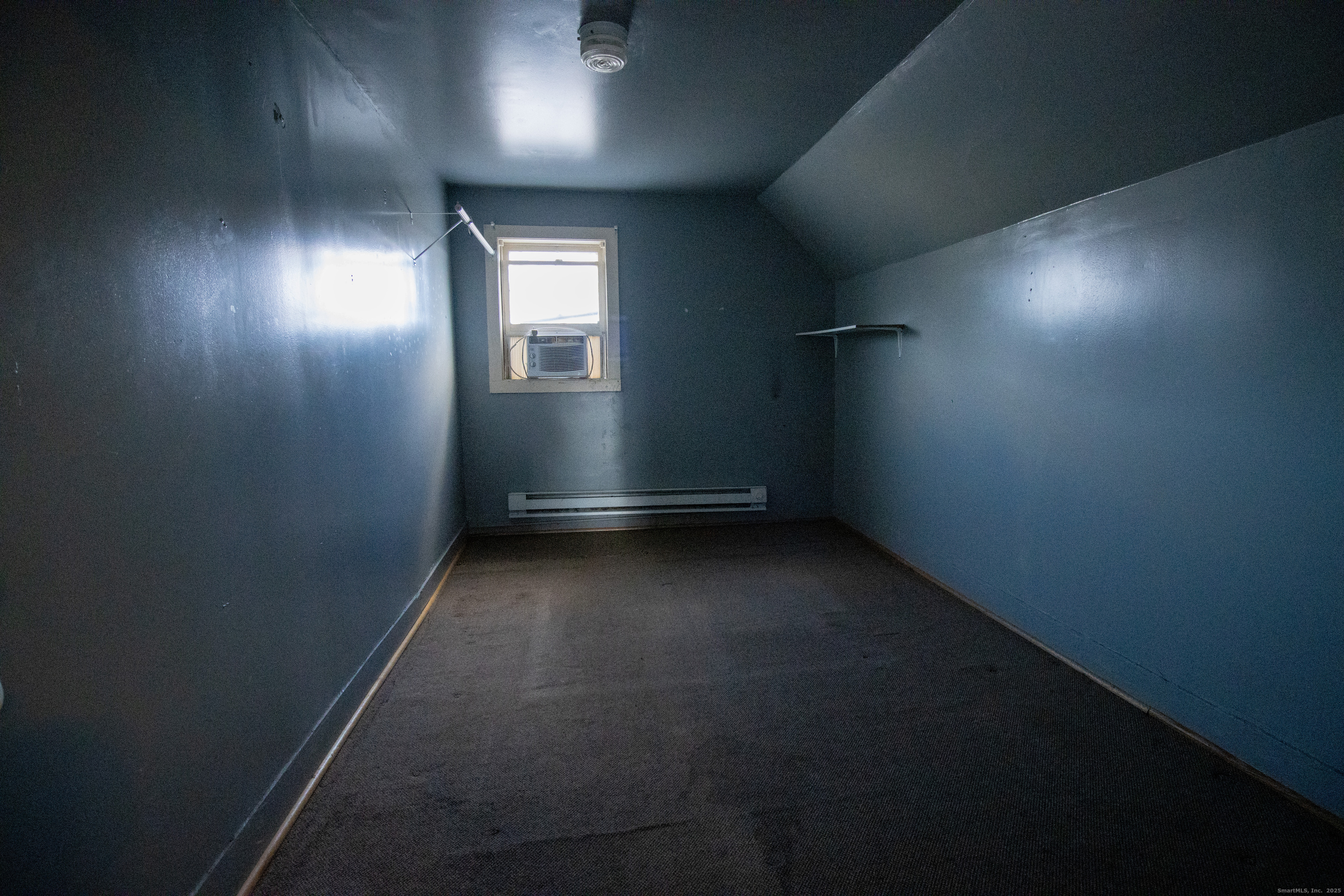 175 Chestnut Avenue Waterbury, CT 06710 - Photo 7 of 15 an empty room with a space and windows