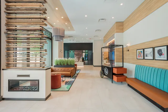 a living room with furniture room and wooden floor
