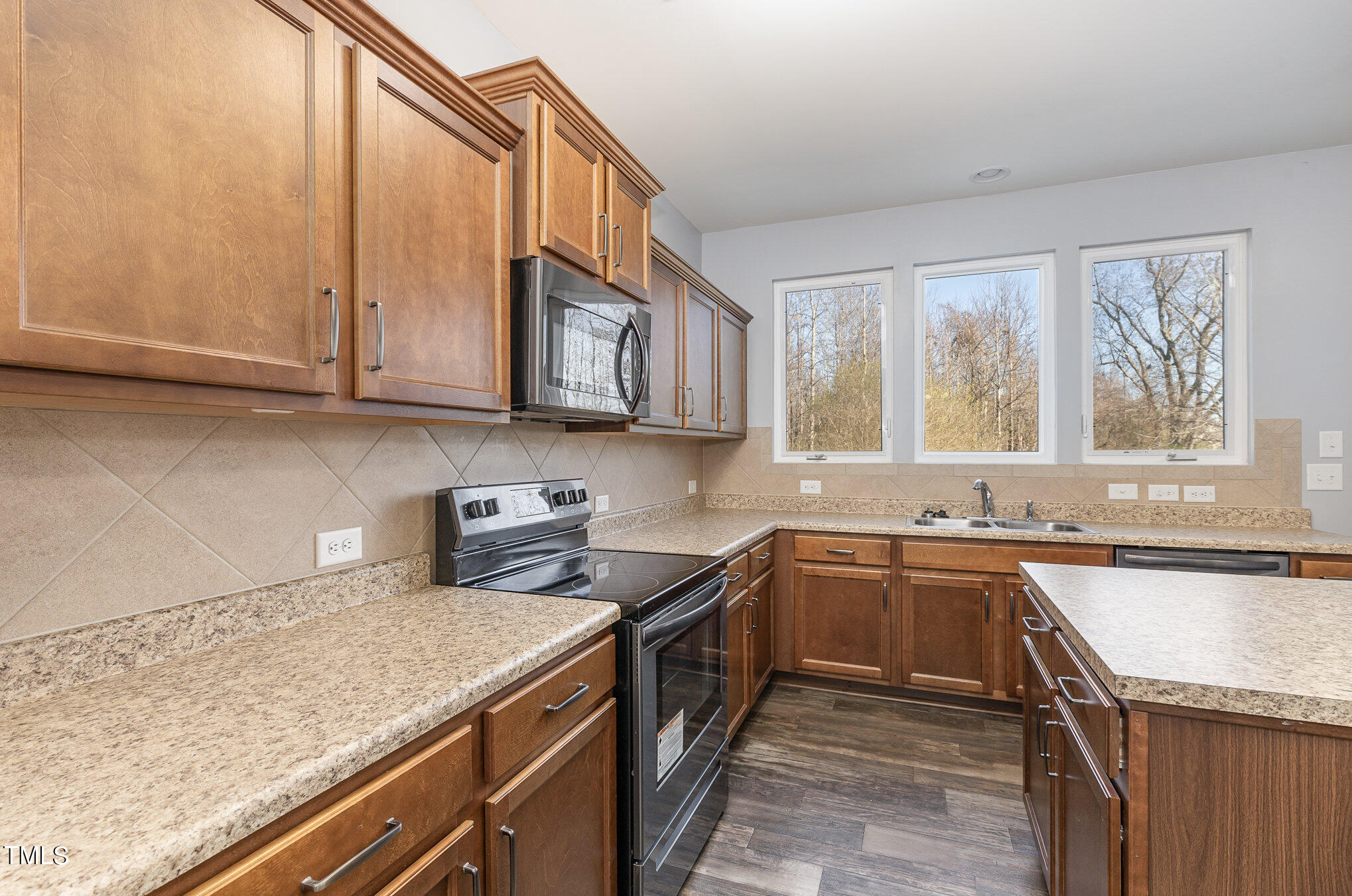 500 Hidden Den Path Wendell, NC 27591 - Photo 11 of 36 a kitchen with a sink stove top oven and cabinets