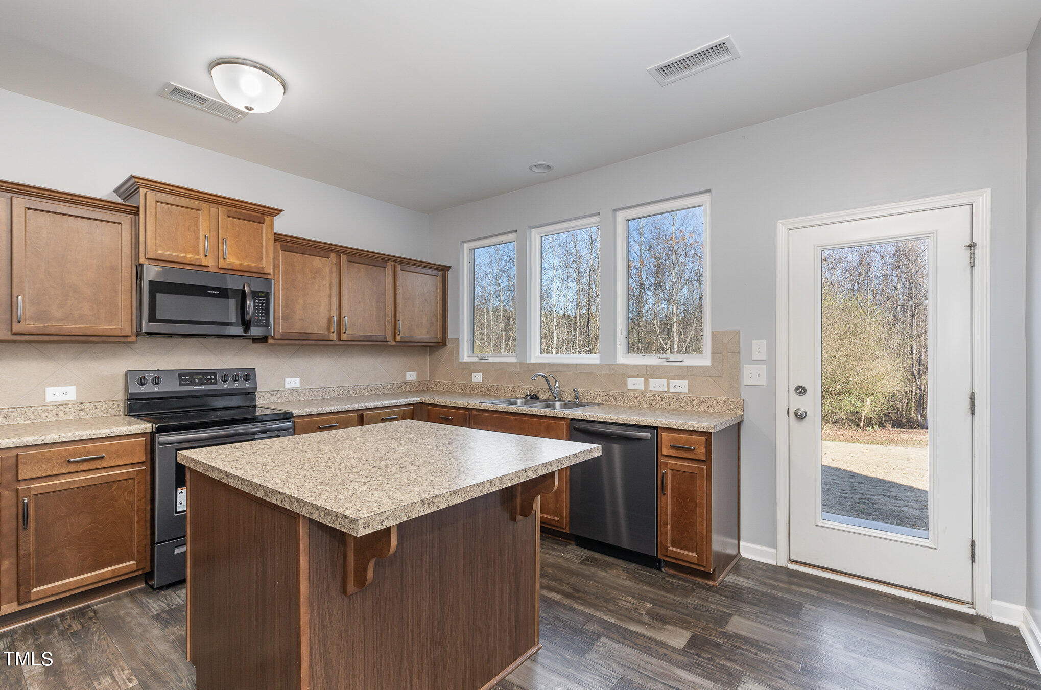 500 Hidden Den Path Wendell, NC 27591 - Photo 12 of 36 a kitchen that has a sink and a stove in it