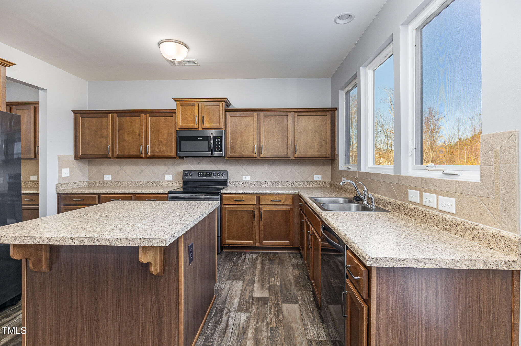 500 Hidden Den Path Wendell, NC 27591 - Photo 13 of 36 a kitchen with granite countertop a sink a counter top space and cabinets