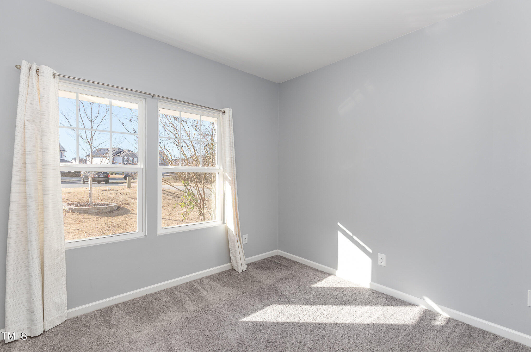 500 Hidden Den Path Wendell, NC 27591 - Photo 16 of 36 a view of an empty room with a window
