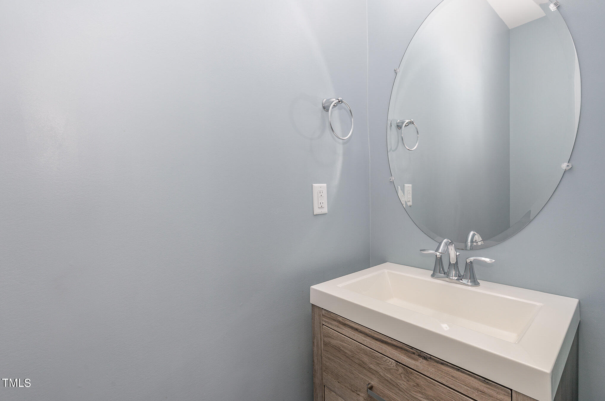 500 Hidden Den Path Wendell, NC 27591 - Photo 17 of 36 a bathroom with a sink a mirror and vanity