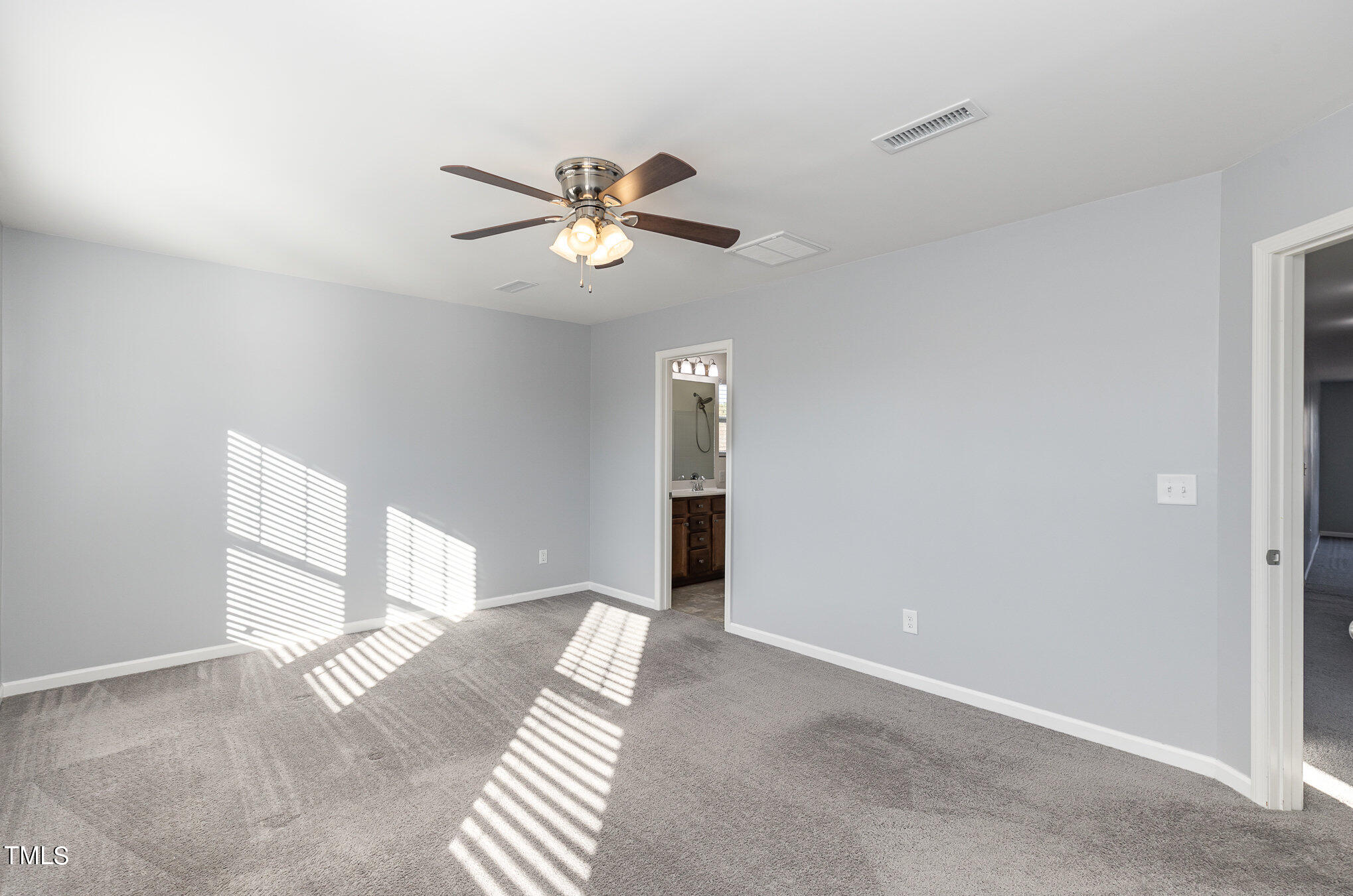 500 Hidden Den Path Wendell, NC 27591 - Photo 23 of 36 a view of an empty room with chandelier fan and a window
