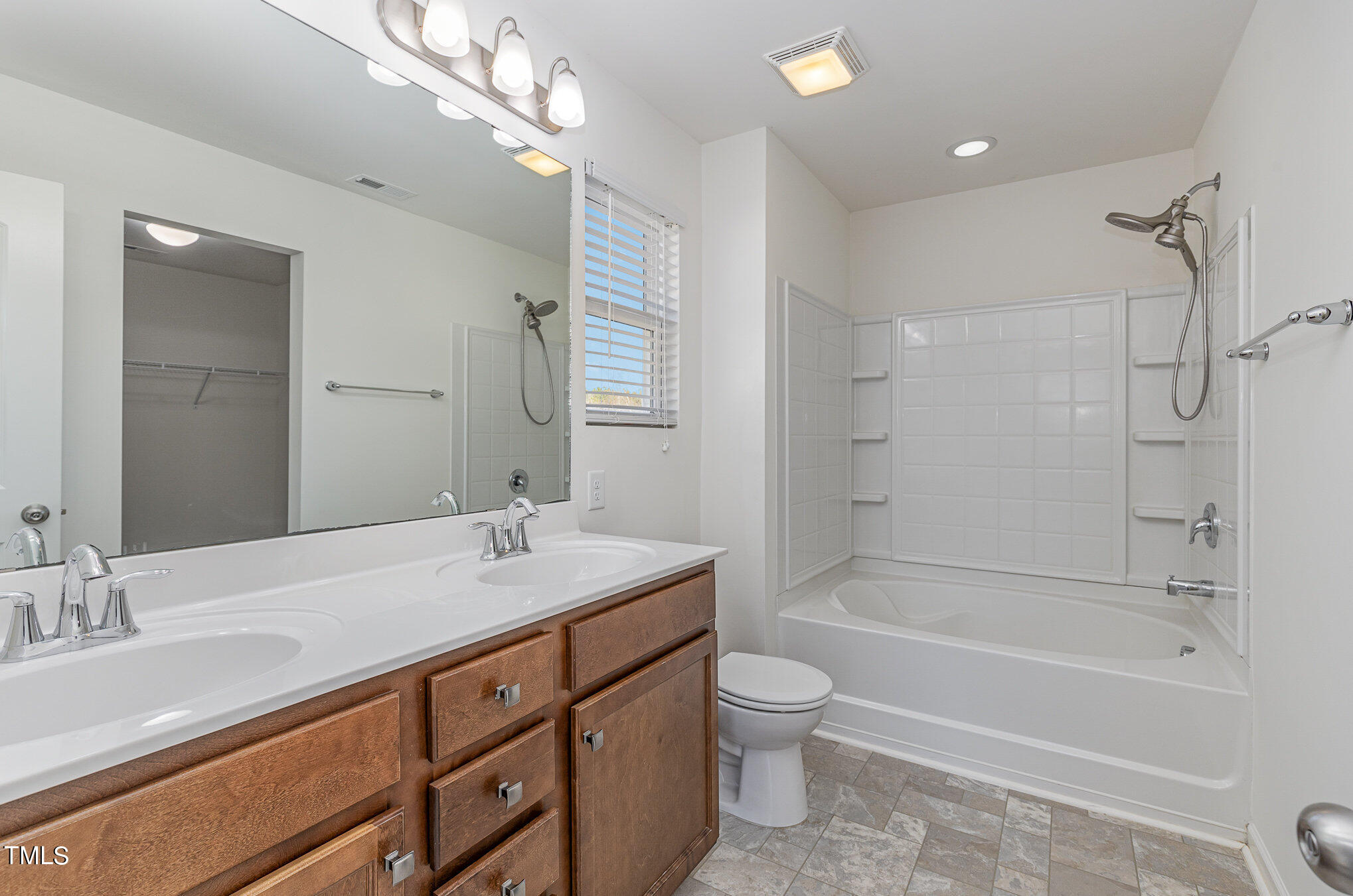 500 Hidden Den Path Wendell, NC 27591 - Photo 25 of 36 a bathroom with a granite countertop sink a toilet and shower