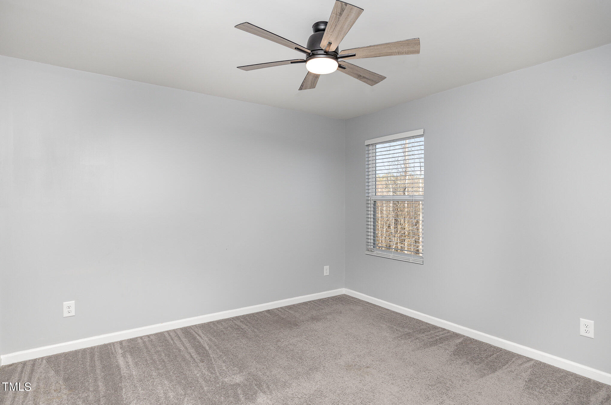 500 Hidden Den Path Wendell, NC 27591 - Photo 28 of 36 an empty room with a window and a fan