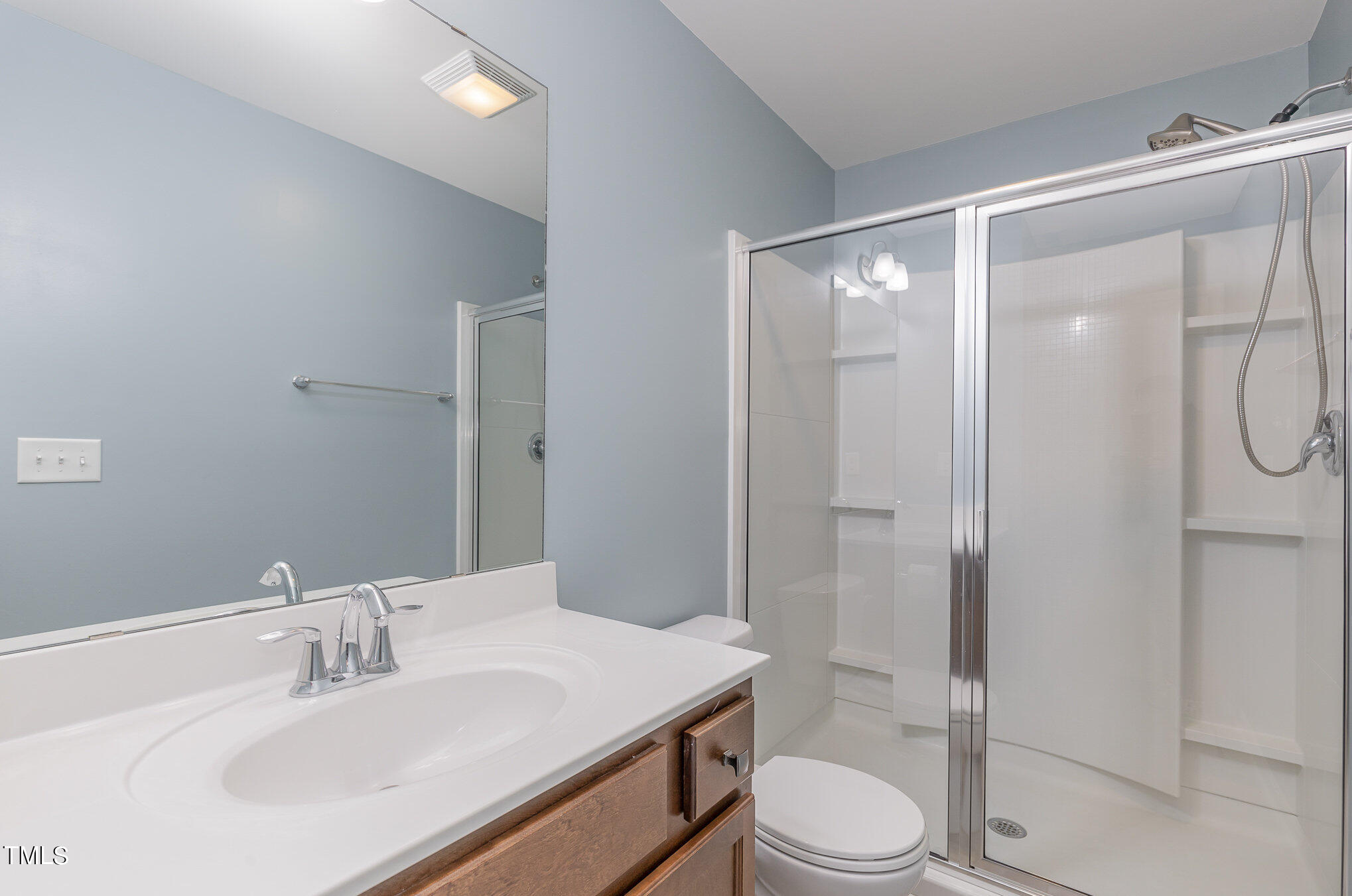 500 Hidden Den Path Wendell, NC 27591 - Photo 31 of 36 a bathroom with a sink toilet vanity and shower