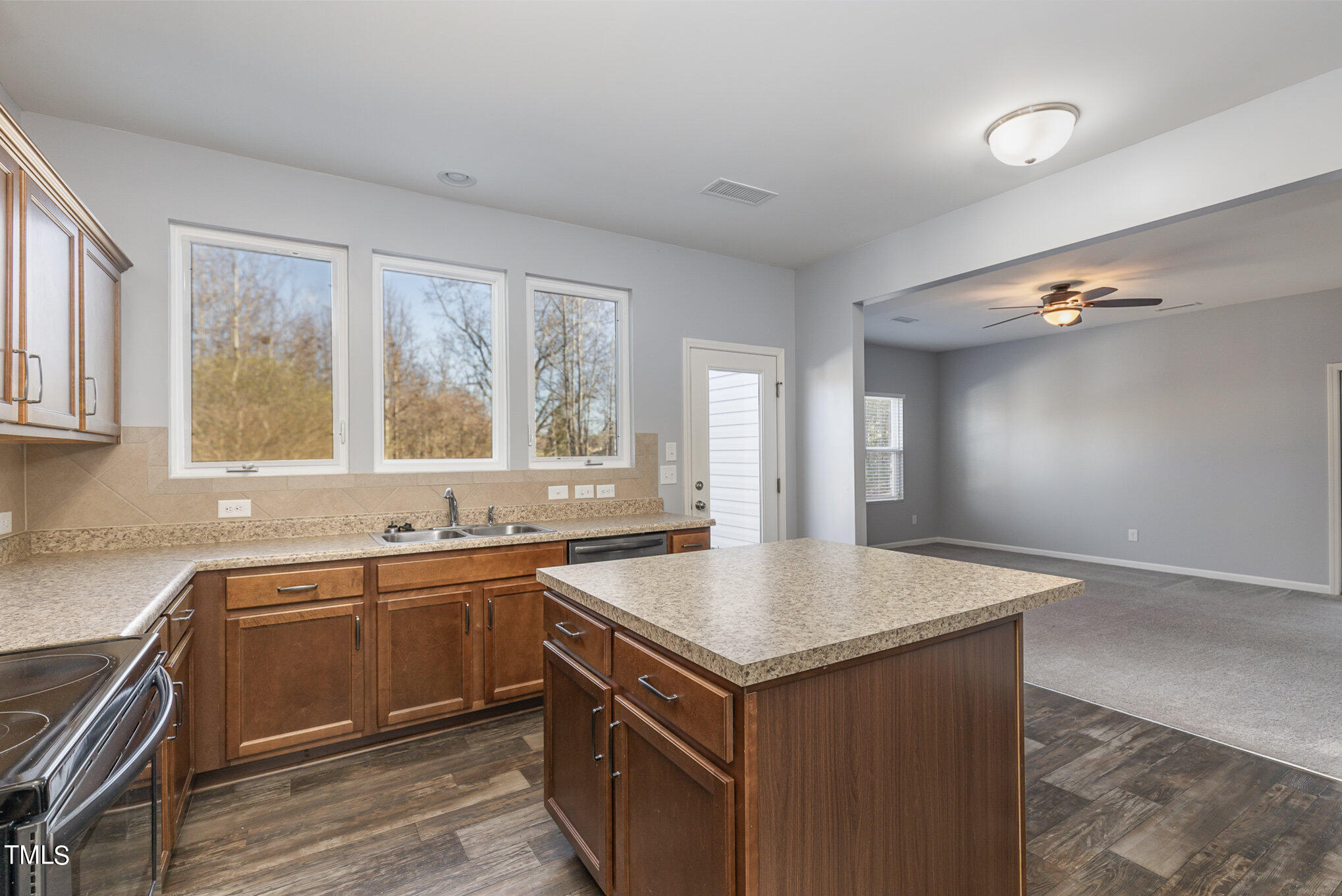 500 Hidden Den Path Wendell, NC 27591 - Photo 8 of 36 a kitchen with a sink stove and cabinets