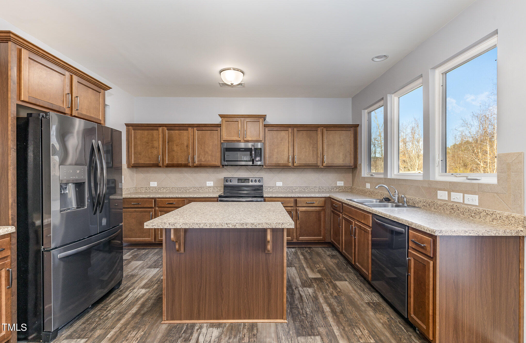 500 Hidden Den Path Wendell, NC 27591 - Photo 10 of 36 a kitchen with stainless steel appliances granite countertop a sink stove refrigerator and cabinets