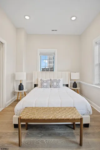 a bedroom with a bed and a table