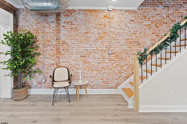 a view of entryway with wooden floor