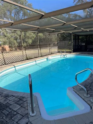 a view of a living room and a floor to ceiling window