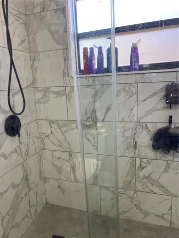 a view of a livingroom with wooden floor and closet