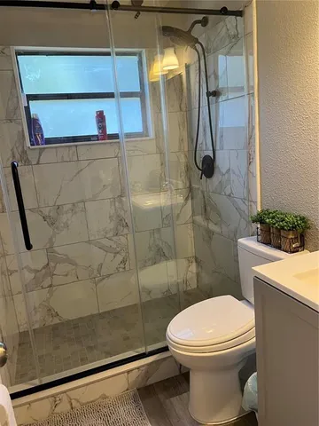 a bathroom with a black white checkered floor