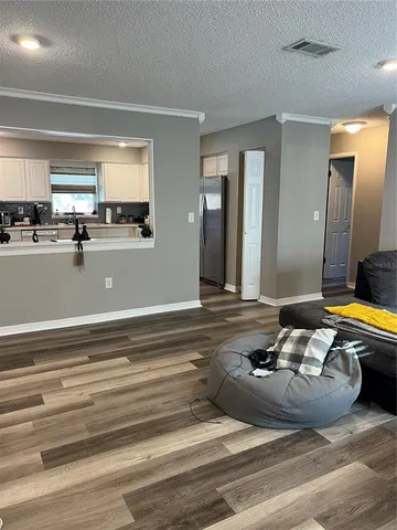 a living room with furniture and a table