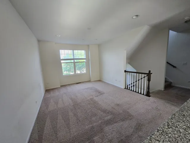 a view of a livingroom with a staircase
