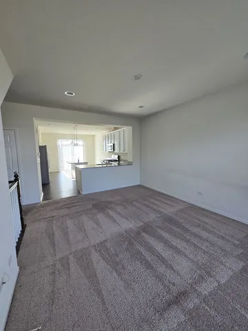a view of empty room with a fireplace