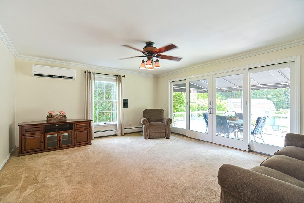 6 Reservation Road Acushnet, MA 02743 - Photo 18 of 42 a living room with furniture and large windows