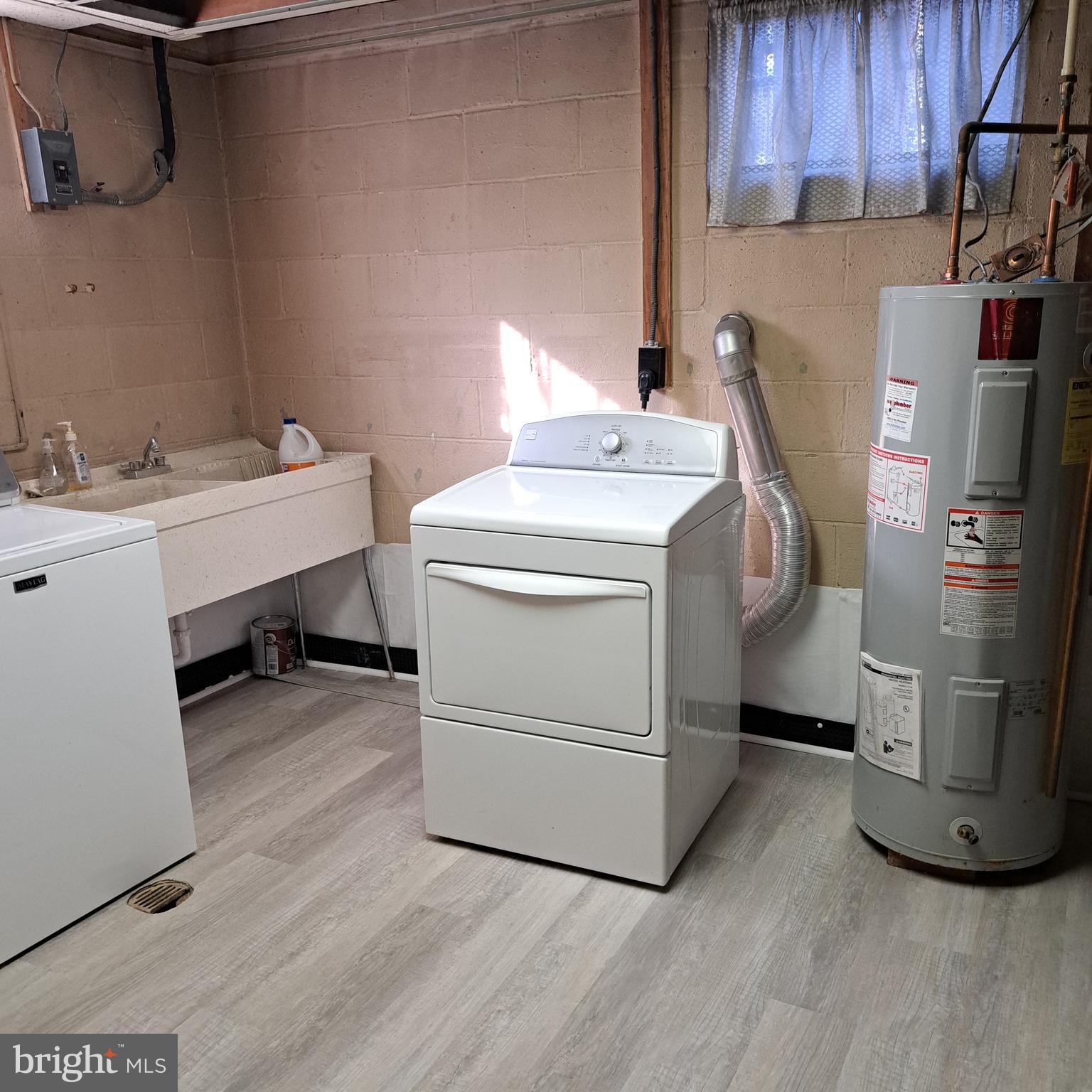 9301 Tuckerman Street Lanham, MD 20706 - Photo 33 of 48 a utility room with dryer and washer