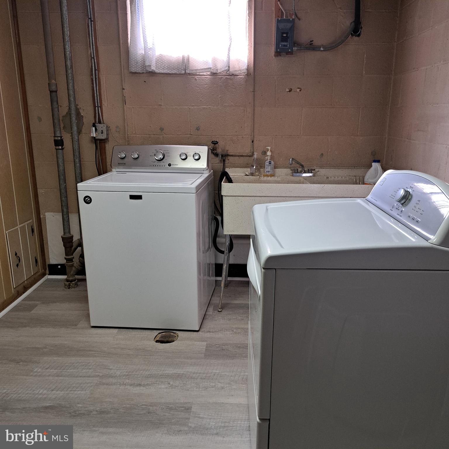9301 Tuckerman Street Lanham, MD 20706 - Photo 34 of 48 a utility room with dryer and washer