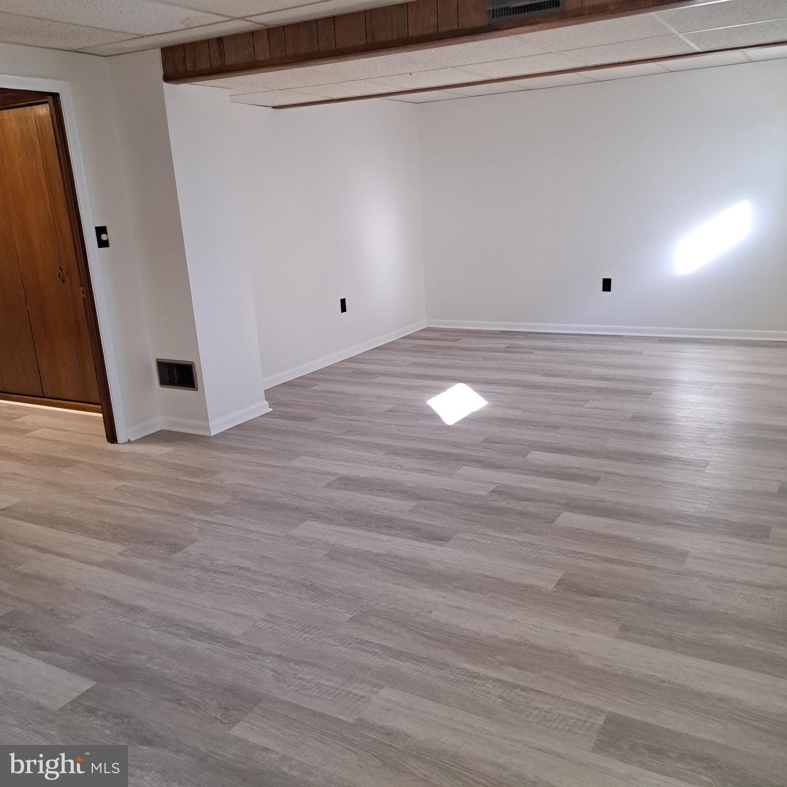 9301 Tuckerman Street Lanham, MD 20706 - Photo 38 of 48 a view of a room with wooden floor