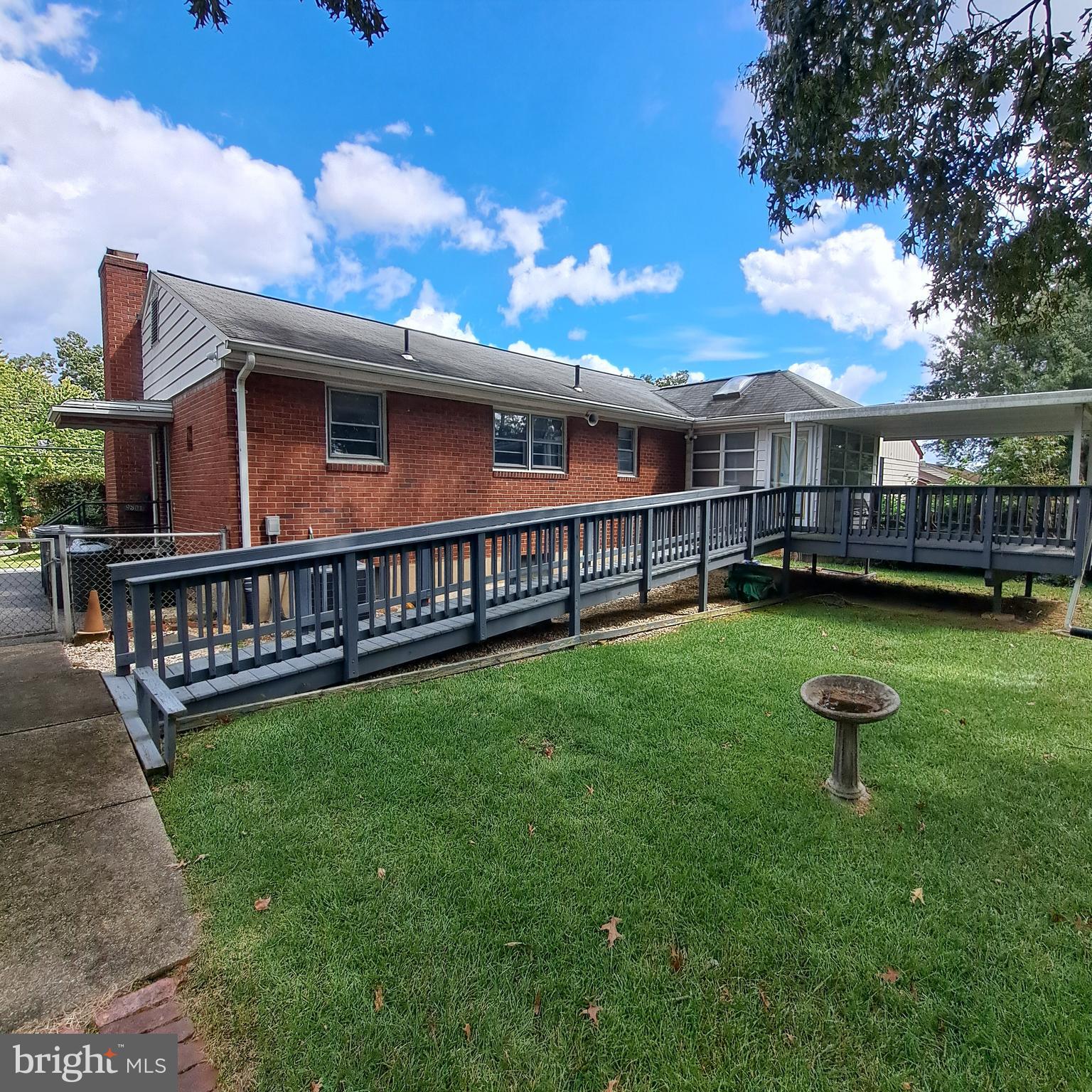9301 Tuckerman Street Lanham, MD 20706 - Photo 45 of 48 a view of a house with a backyard