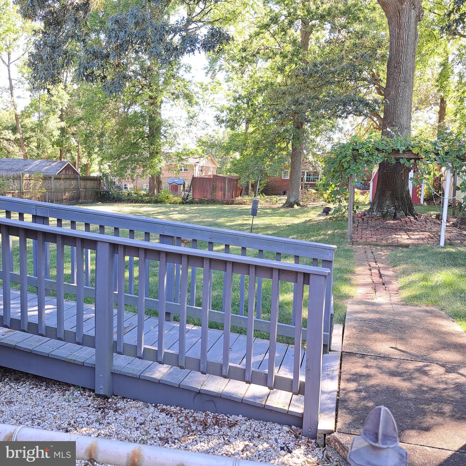 9301 Tuckerman Street Lanham, MD 20706 - Photo 7 of 48 a view of a chair and tables in the patio