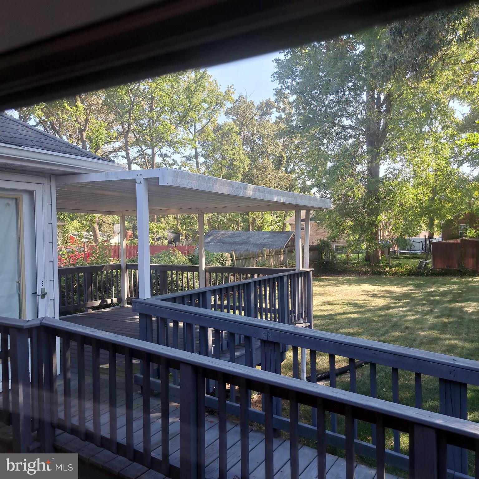 9301 Tuckerman Street Lanham, MD 20706 - Photo 9 of 48 a view of a porch with a yard