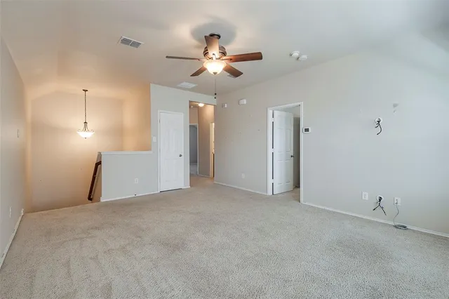 a view of a livingroom with a ceiling fan