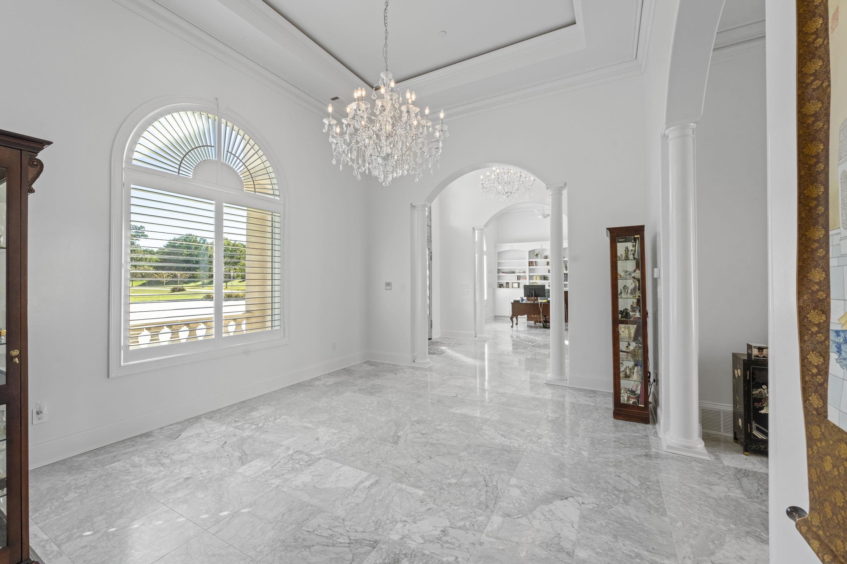 881 Bray Station Road Collierville, TN 38017 - Photo 3 of 40 Interior space featuring arched walkways, a high ceiling, decorative columns, marble tiled flooring, and ornamental molding
