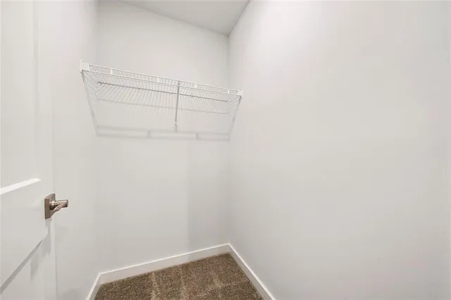 a bathroom with a granite countertop toilet a sink and a bathtub