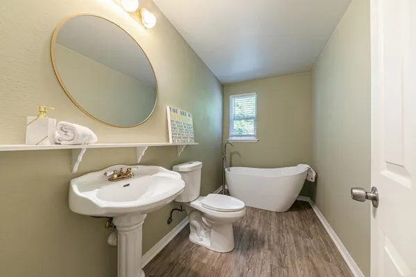 a bathroom with a sink and mirror