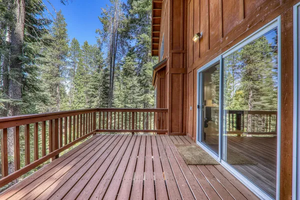 a view of balcony with wooden floor