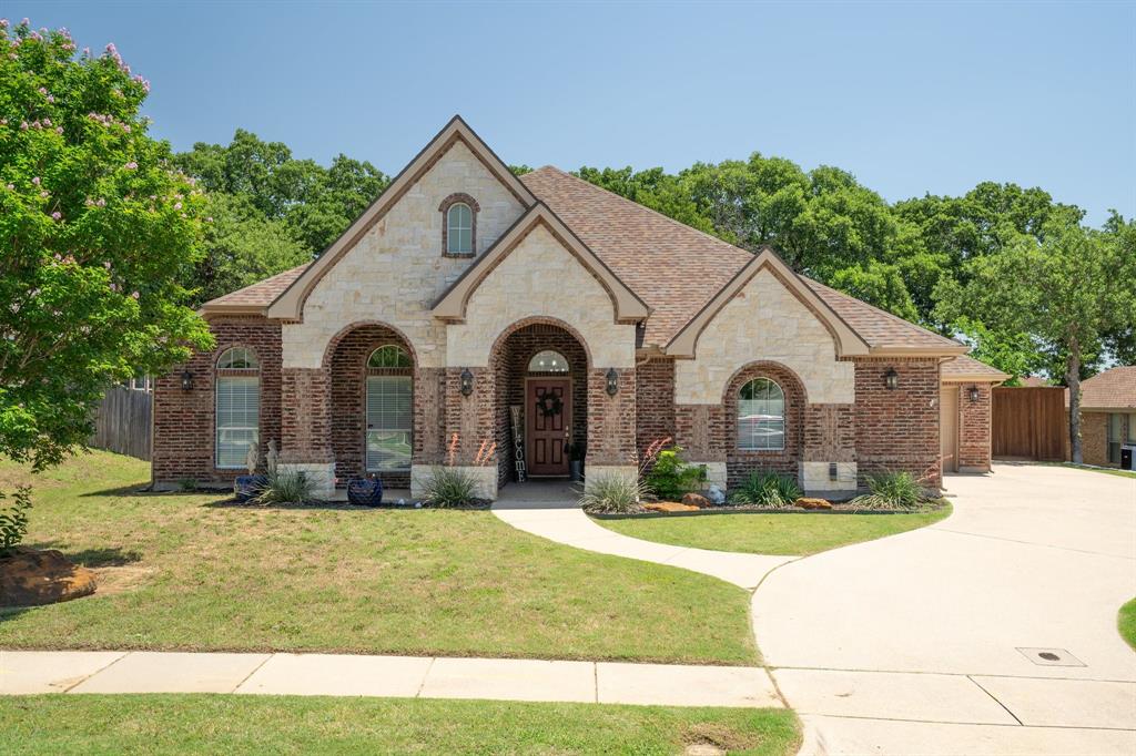 a view of house with yard and green space