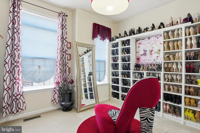 a view of living room with clothes and shoes