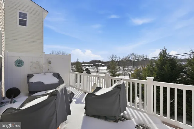 a view of a balcony with furniture